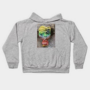 A Bali face mask with finger on its mouth. Kids Hoodie